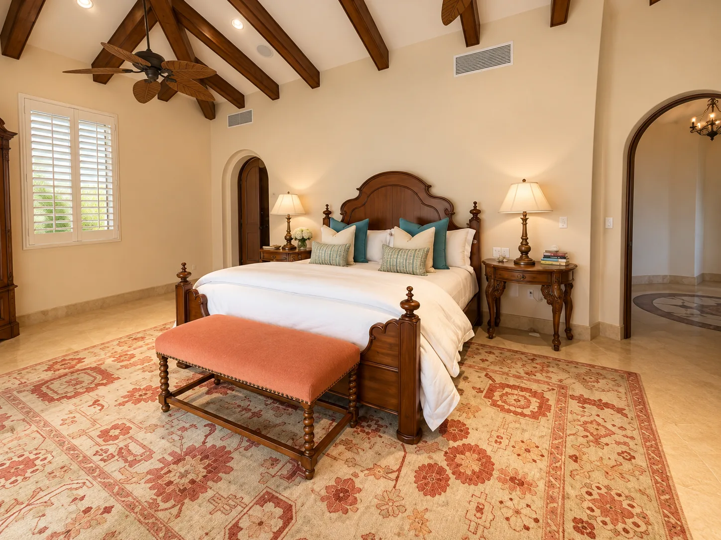 The primary suite beneath beamed ceilings.
